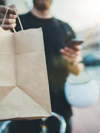 Food delivery courier handing over an order